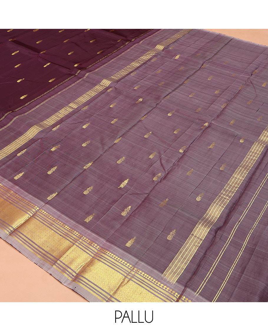 Brown Kanchipuram Silk Saree, Ornamented with Thazampoo Rekku Zari Buttas on Its Body, Complemented by Contrast One-Sided Border of Panner Sombu, Banaras, Muthu, and Mayil Kann Designs, Pallu Features Zari Designs, and Comes Without a Blouse