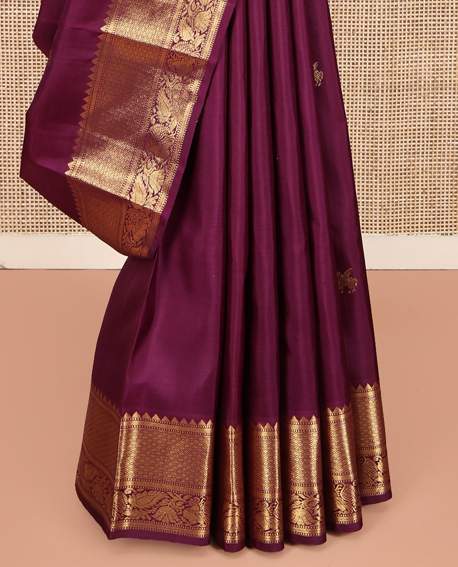Maroon Kanchipuram Silk Saree, Accentuated with Kuthirai Buttas All Over Its Body, Highlighted by a Zari Border of Rekku, Muthu, Kathir, Mayil Kann, and Mayil Designs, Grand Jaal Pallu, and Paired with a Matching Blouse