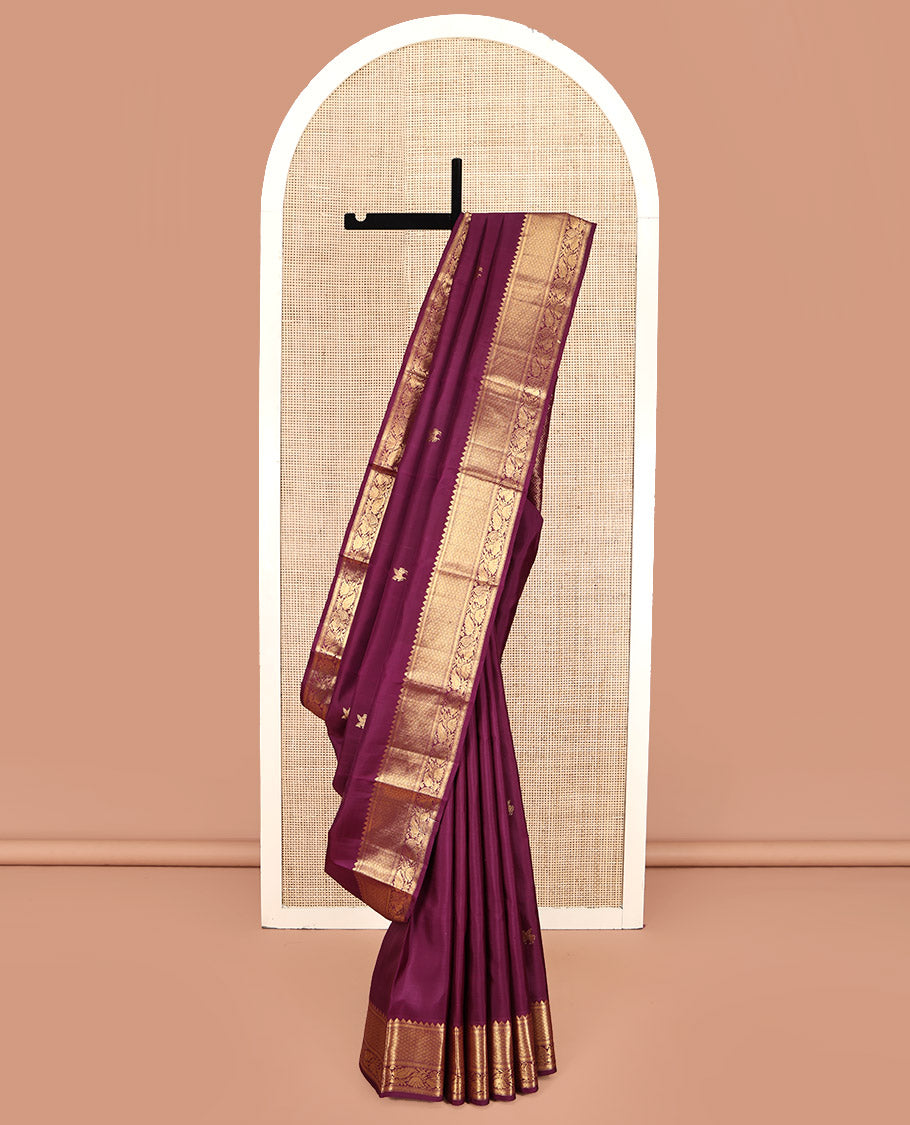 Maroon Kanchipuram Silk Saree, Accentuated with Kuthirai Buttas All Over Its Body, Highlighted by a Zari Border of Rekku, Muthu, Kathir, Mayil Kann, and Mayil Designs, Grand Jaal Pallu, and Paired with a Matching Blouse