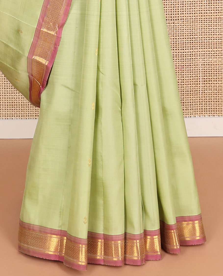 Mint green buttas kancheepuram silk saree with contrast border of banaras, kuyil kann design & zari design pallu