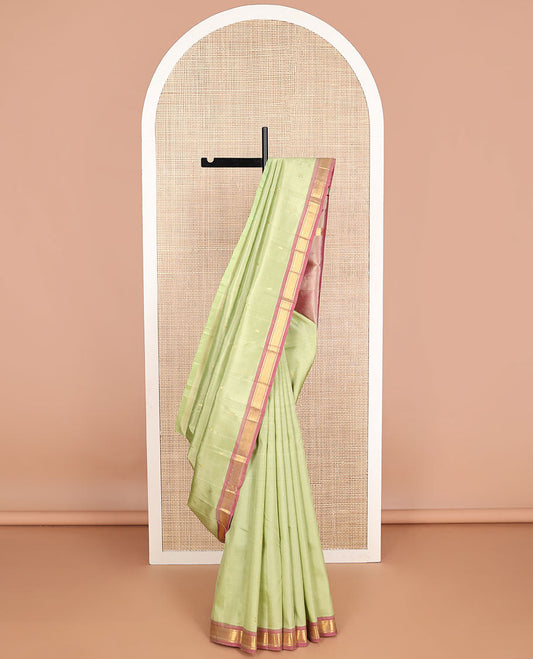 Mint green buttas kancheepuram silk saree with contrast border of banaras, kuyil kann design & zari design pallu