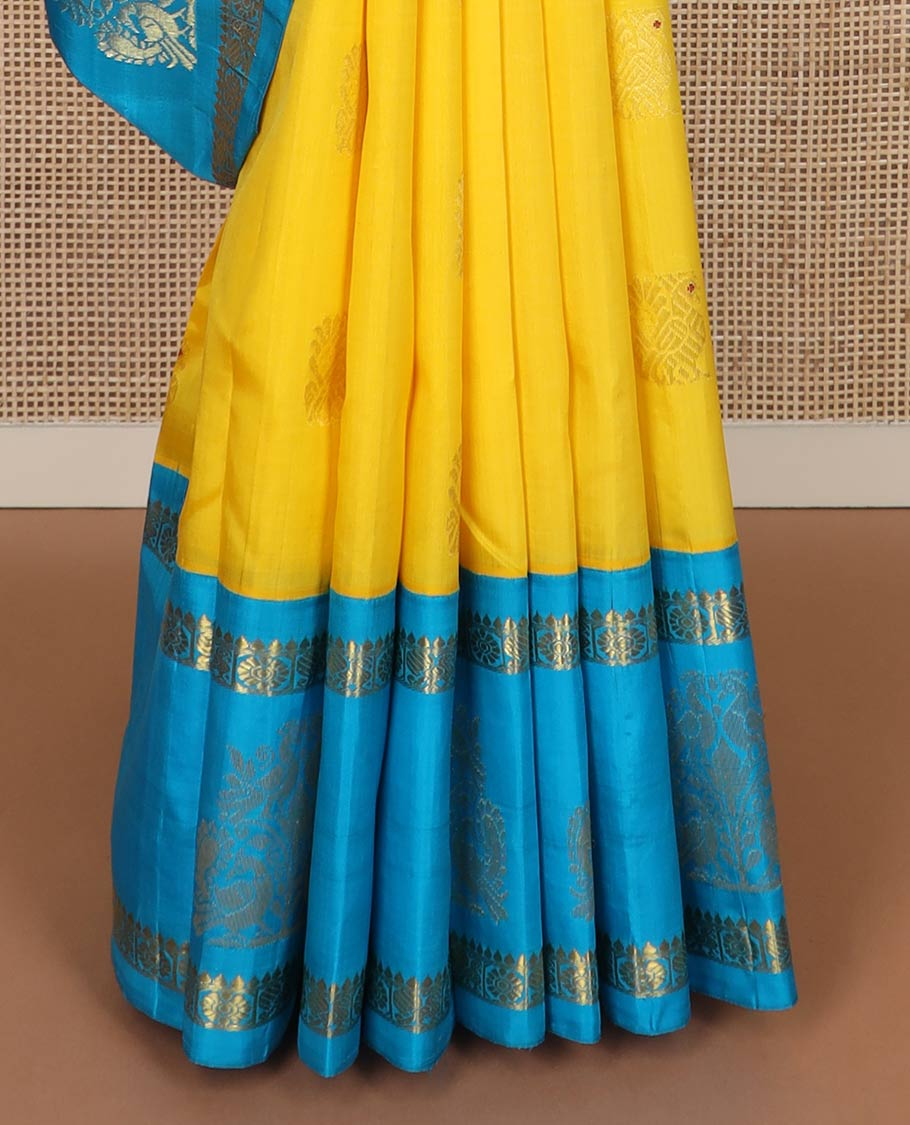 Yellow meena mayil buttas silk saree, contrast korvai one-sided border of thilakam,annam chakram & mayil designs & floral design pallu