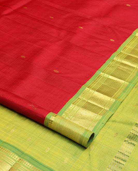 Red zari buttas Kanchipuram silk saree, contrast one-sided korvai border of paneer sombu, banaras, muthu, and mayil kann design, and zari design pallu