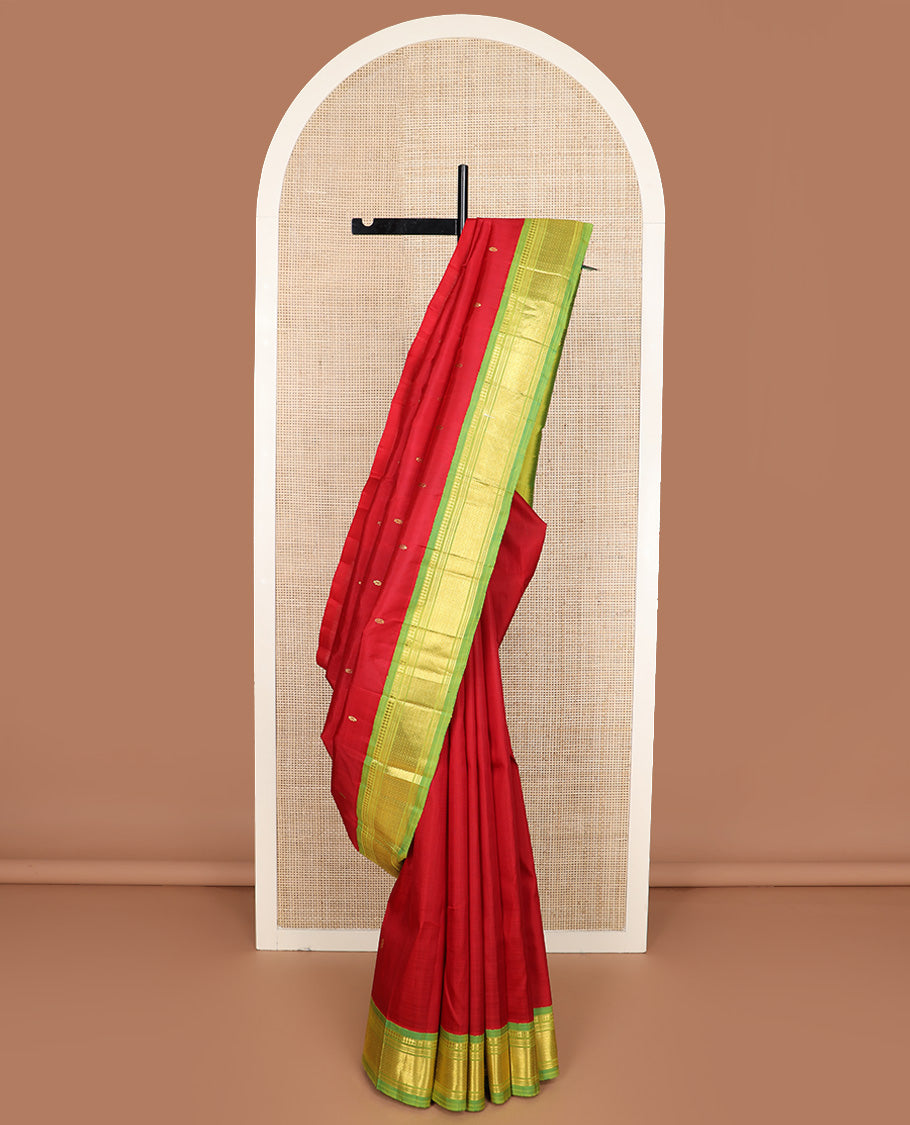 Red zari buttas Kanchipuram silk saree, contrast one-sided korvai border of paneer sombu, banaras, muthu, and mayil kann design, and zari design pallu