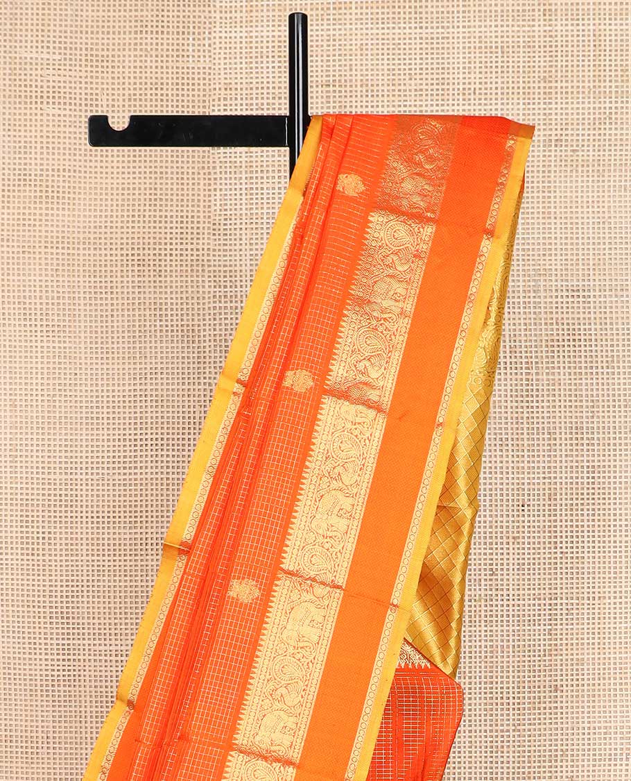 Orange checked with kuthirai and iruthalai pakshi buttas Kanchipuram silk saree, zari border of rekku, paisa, yaanai, mayil, and mayil kann, and paiyadi kattam pallu