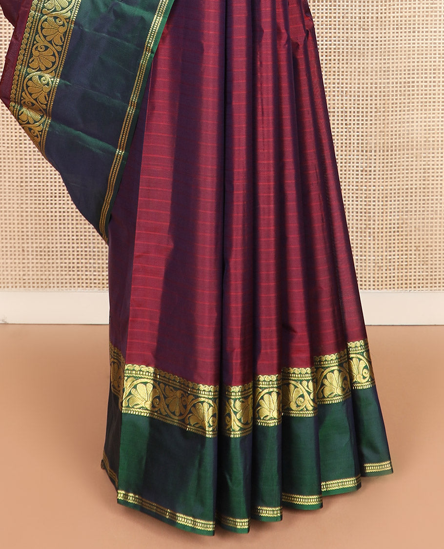 Maroon striped Kanchipuram silk saree, contrast rettai pettu border of manga, muthu, banaras, and kodi visiry designs, and zari striped pallu
