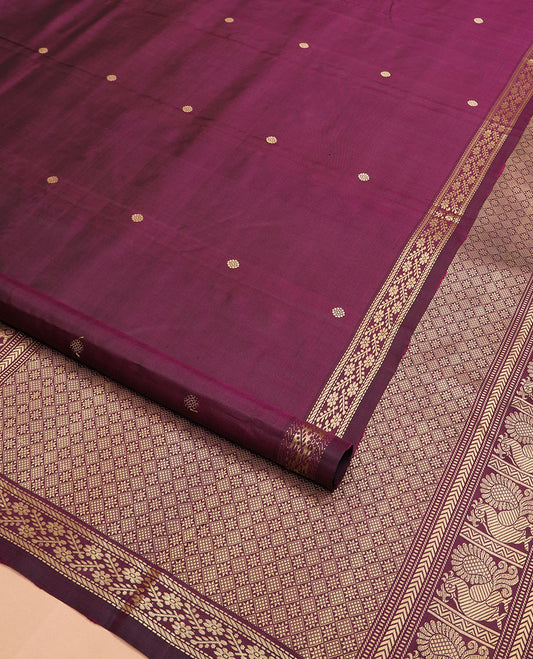 Maroon chakram buttas Kanchipuram silk saree, self-border of muthu, banaras, and floral designs, and jaal pallu