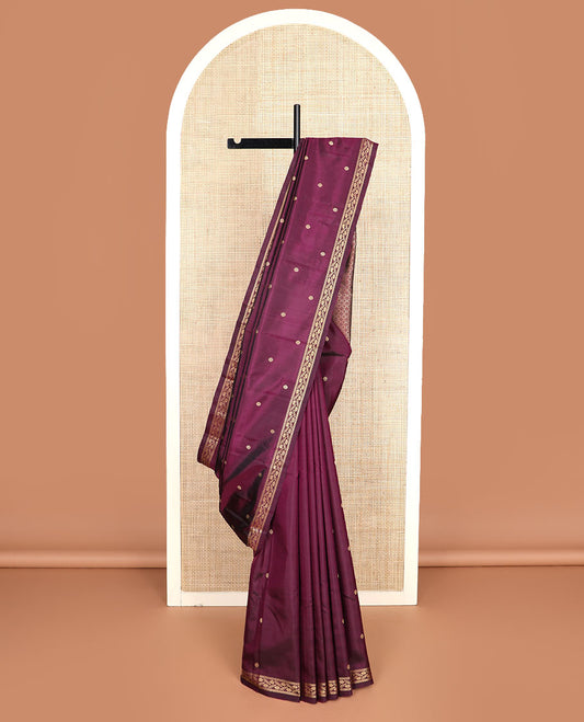Maroon chakram buttas Kanchipuram silk saree, self-border of muthu, banaras, and floral designs, and jaal pallu