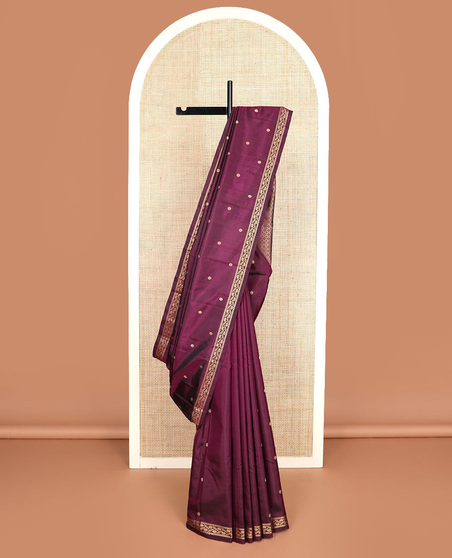 Maroon chakram buttas Kanchipuram silk saree, self-border of muthu, banaras, and floral designs, and jaal pallu