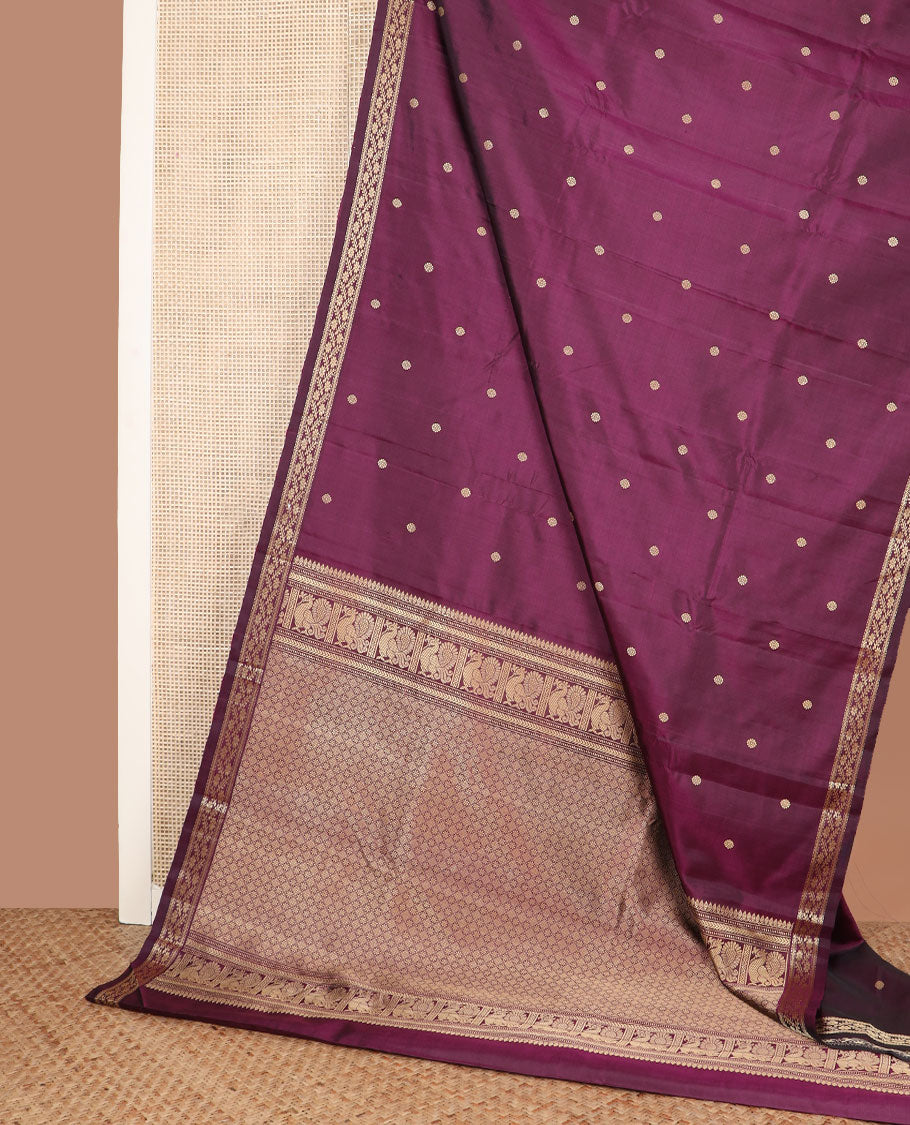 Maroon chakram buttas Kanchipuram silk saree, self-border of muthu, banaras, and floral designs, and jaal pallu