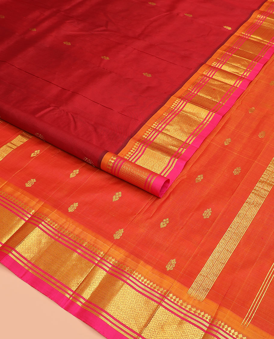 Maroon zari buttas Kanchipuram silk saree, contrast border of paneer sombu, banaras, and mayil kann designs, and zari design pallu