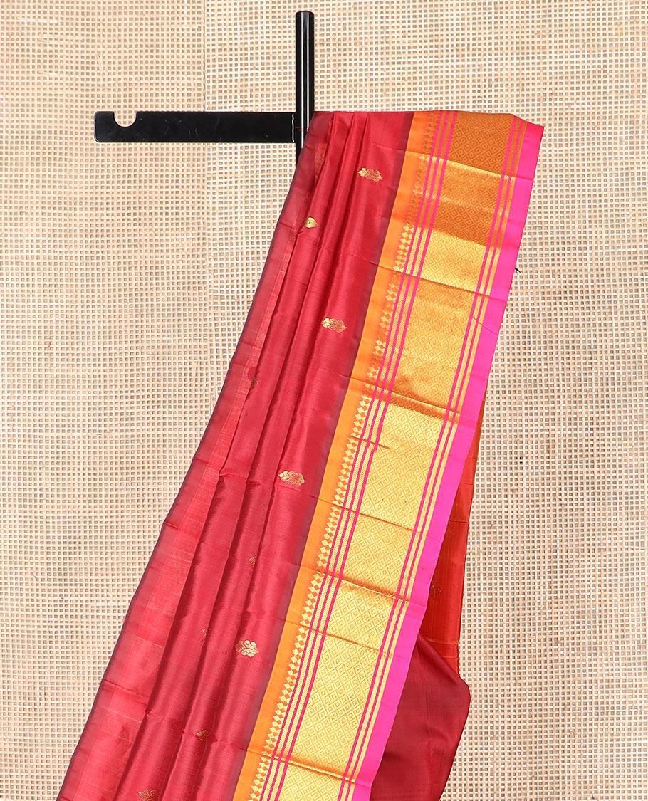 Maroon zari buttas Kanchipuram silk saree, contrast border of paneer sombu, banaras, and mayil kann designs, and zari design pallu
