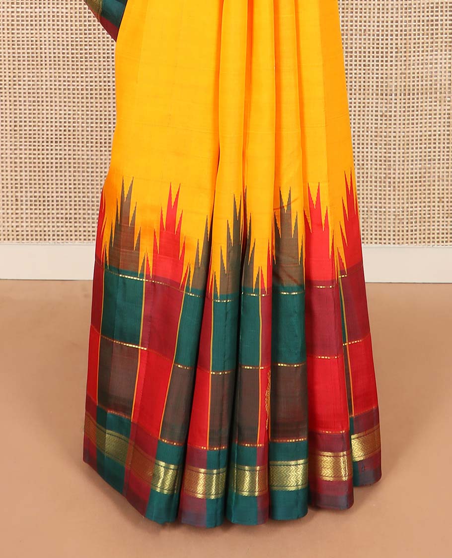 Yellow zari buttas Kanchipuram silk saree, contrast thazampoo rekku checked one-sided border of banaras, and vanki designs, and pallu of intricate designs