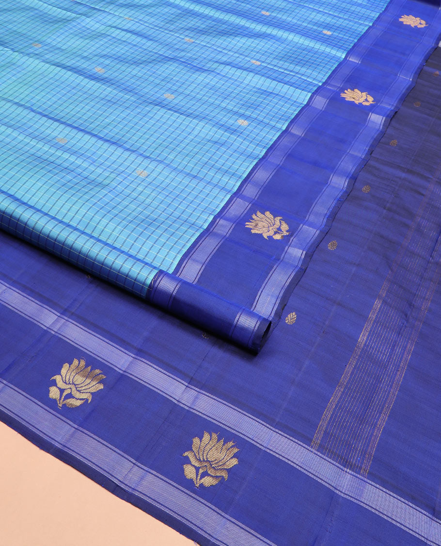 Blue checked and buttas Kanchipuram silk saree, contrast border of lotus designs, and pallu of zari designs