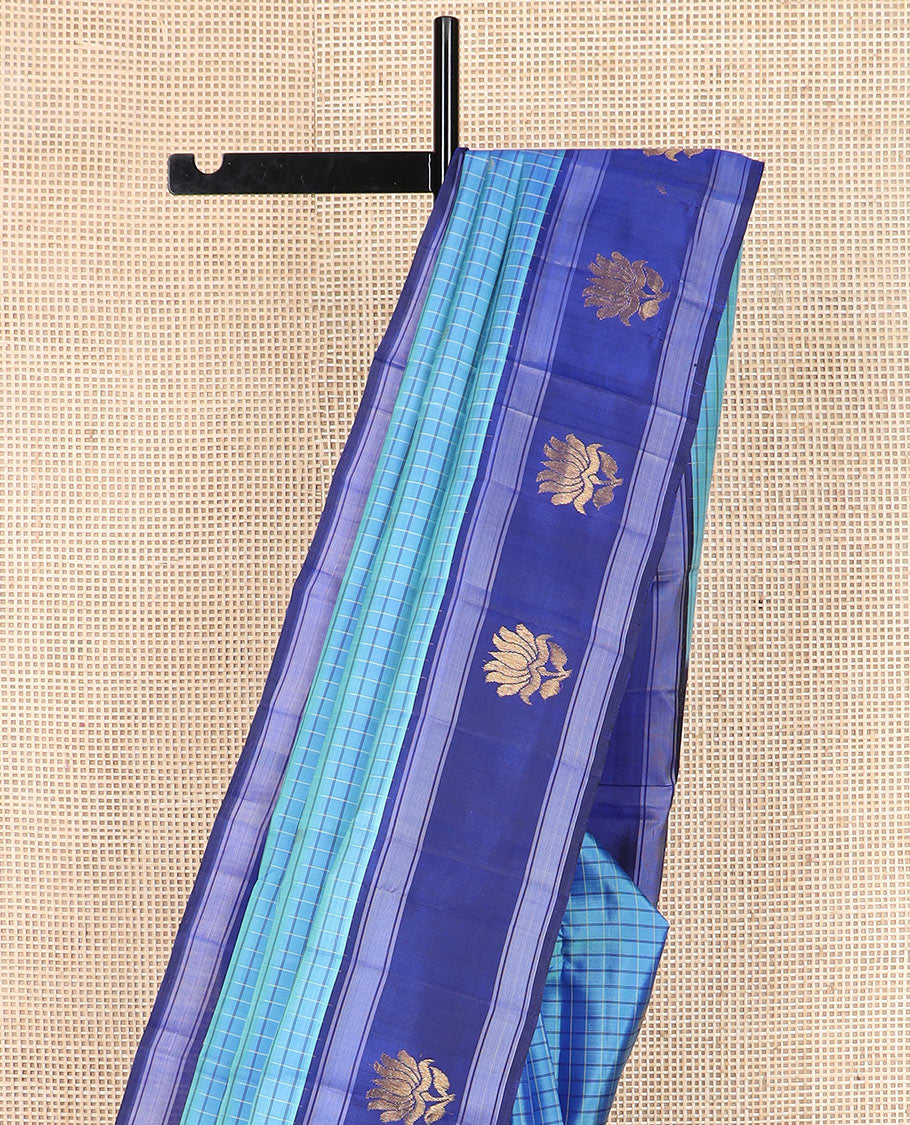 Blue checked and buttas Kanchipuram silk saree, contrast border of lotus designs, and pallu of zari designs