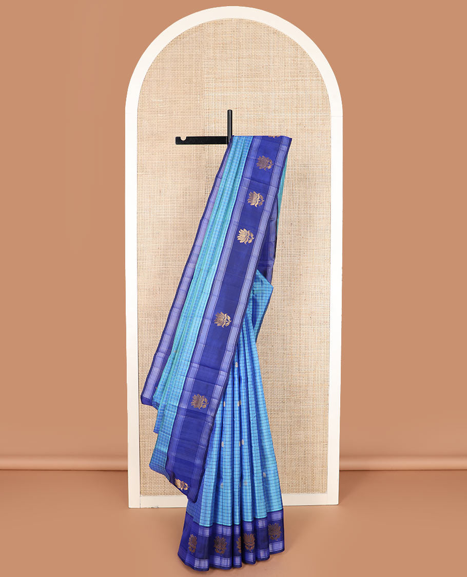 Blue checked and buttas Kanchipuram silk saree, contrast border of lotus designs, and pallu of zari designs