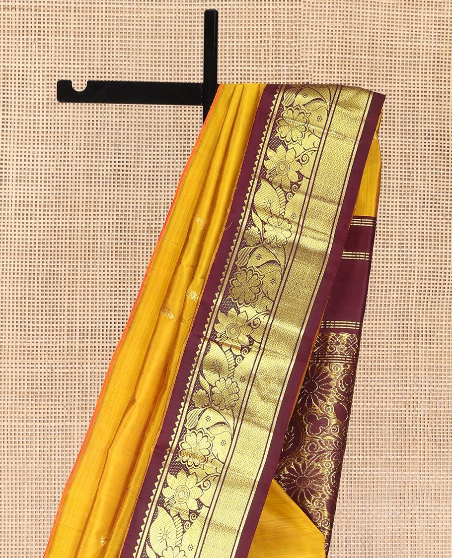Mustard Kanchipuram Silk Saree, Decorated with Zari Buttas, Complemented by Contrast One-Sided Korvai Border of Rekku, Banaras, Floral and Mayil Kann Designs, Pallu of Floral-Paisley Designs, and Comes Without a Blouse