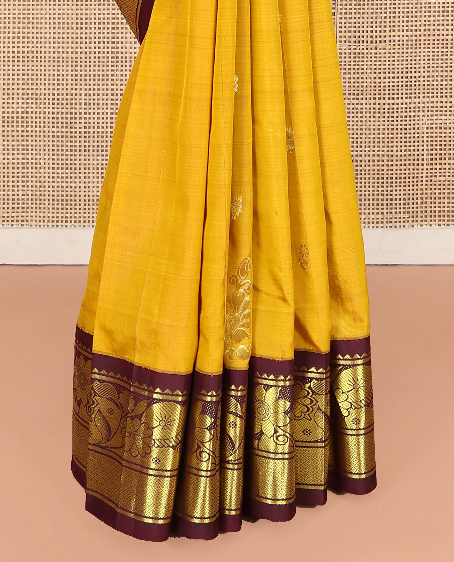 Mustard Kanchipuram Silk Saree, Decorated with Zari Buttas, Complemented by Contrast One-Sided Korvai Border of Rekku, Banaras, Floral and Mayil Kann Designs, Pallu of Floral-Paisley Designs, and Comes Without a Blouse