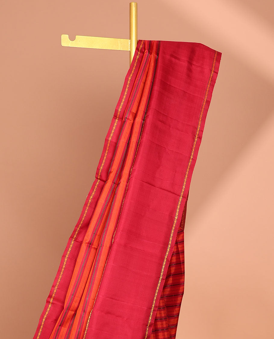 Red striped kancheepuram silk saree  with contrast rettai pettu border & pallu of argyle pattern