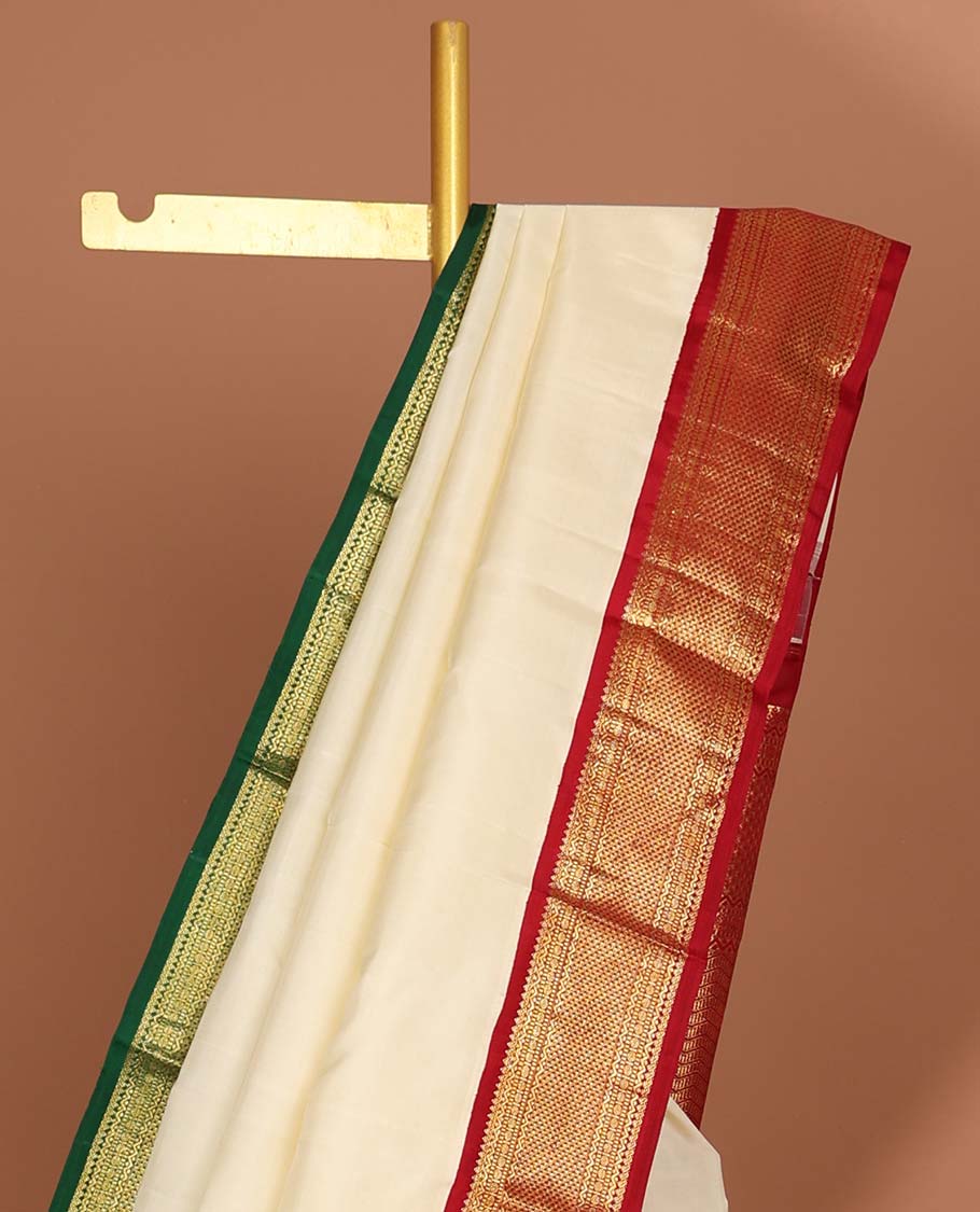 White kancheepuram silk saree with intricate zari design pallu & korvai border of rekku,paun,ara maadam designs