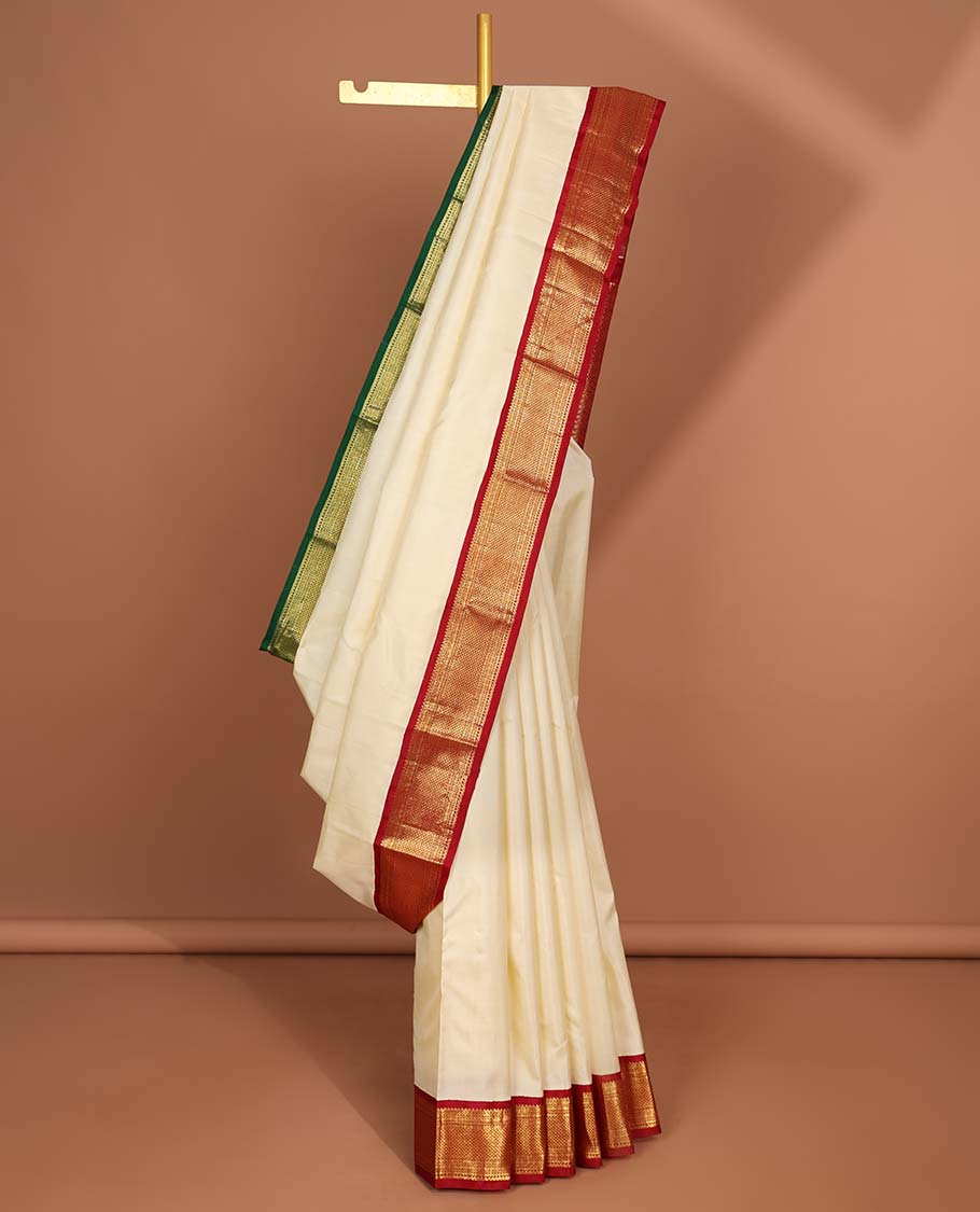White kancheepuram silk saree with intricate zari design pallu & korvai border of rekku,paun,ara maadam designs