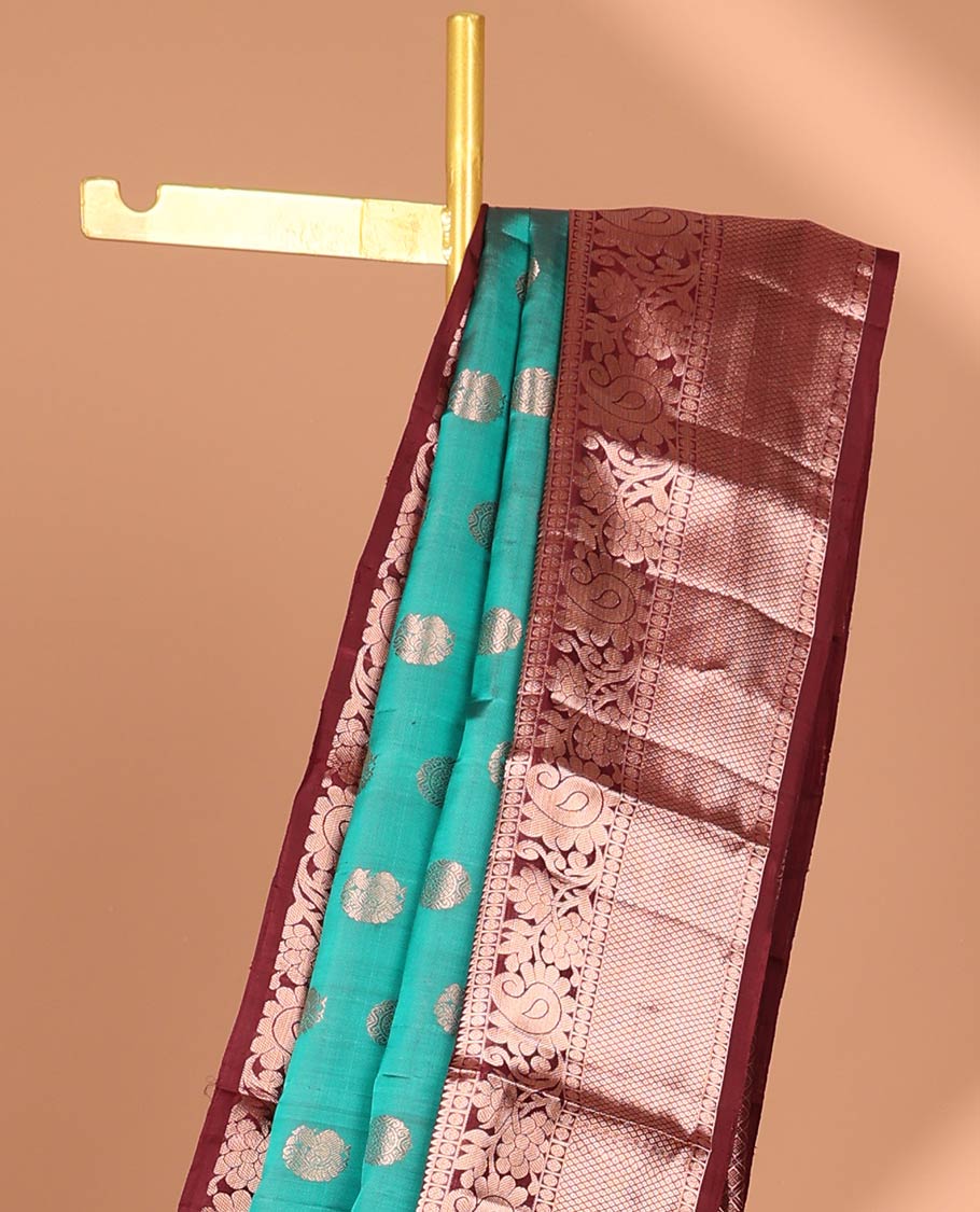 Green peacock buttas kancheepuram silk saree with contrast border of thilakam mokku, paun, mayil kann & zari design pallu