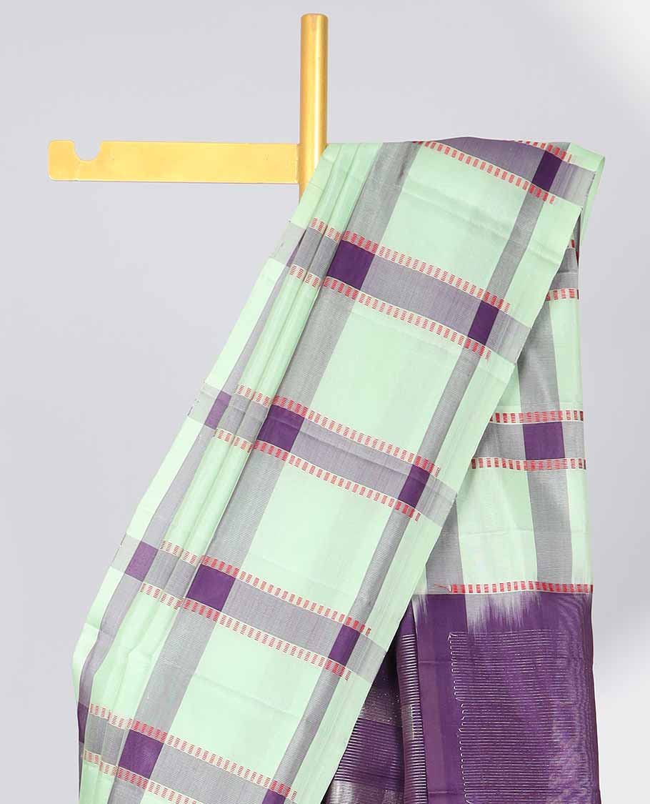 Borderless green checked soft silk saree with intricate zari design pallu