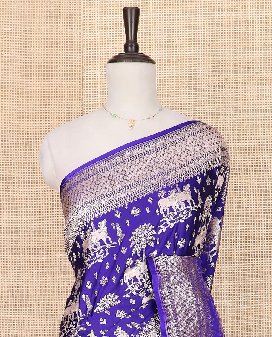 Blue zari buttas and Pichwai cow buttas mushru silk saree, traditional design border, and zari-rich jaal pallu