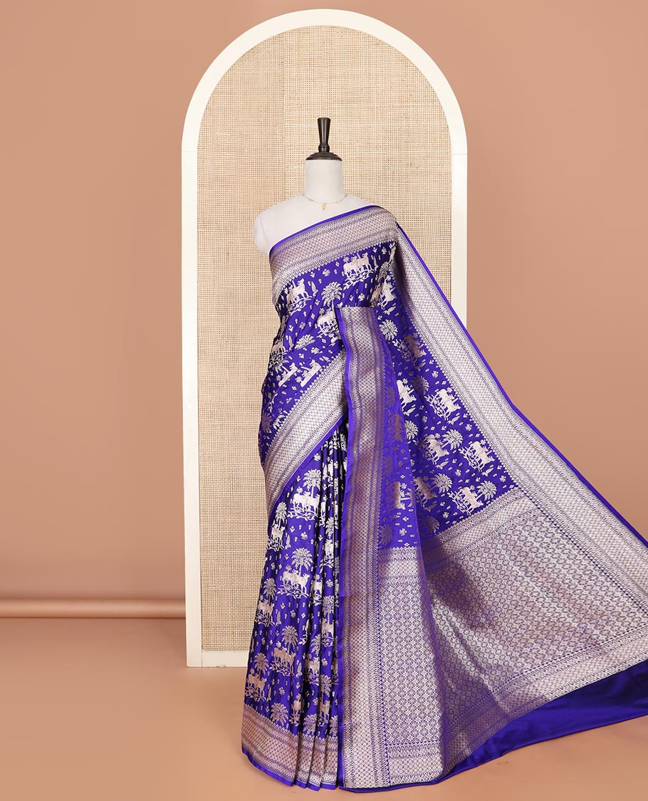 Blue zari buttas and Pichwai cow buttas mushru silk saree, traditional design border, and zari-rich jaal pallu
