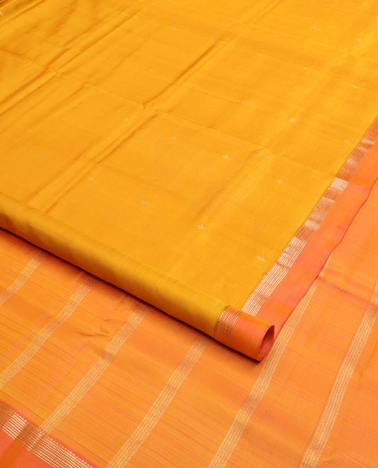 Orange zari buttas nine-yard silk saree, contrast kaal erangina border of rekku and Muthu designs, and pallu of zari designs