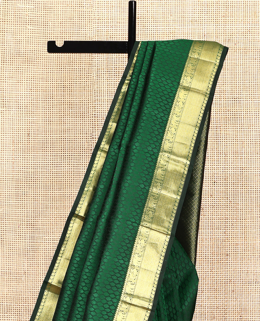Green Embossed Parampara Silk Saree, Elevated with Zari Border of Thilakam, Mayil, Yaanai, Mayil Kann, and Manga Designs, Grand Jaal Pallu and Paired with a Matching Blouse