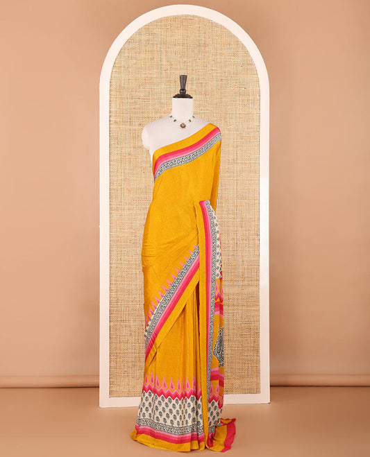 Gold plain crepe silk saree, contrast floral & geometric block printed-style border, printed pallu & contrast plain blouse