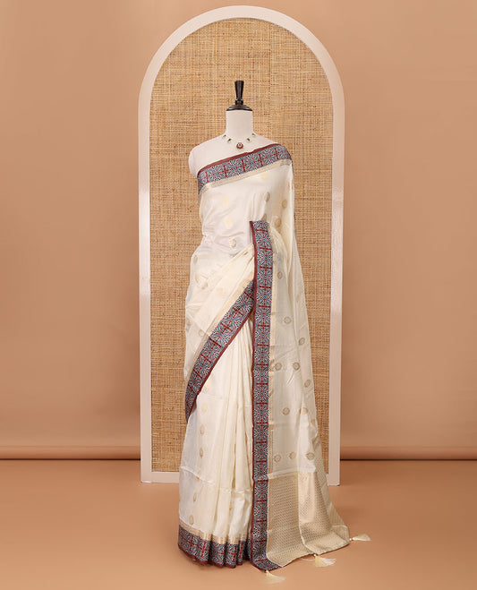 Cream gold zari buttas semi-organza saree, contrast zari & Ajrakh printed brown border, zari weaving pallu & Ajrakh printed blouse