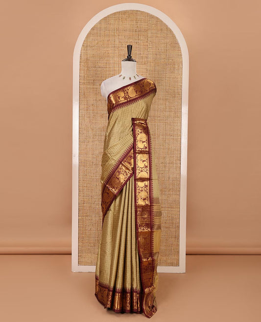 Green zari checked semi-taffeta silk saree, contrast annam motifs zari woven temple border, striped pallu & contrast striped zari border blouse