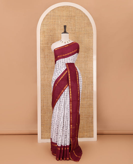 White-purple Tamil letters printed Sungudi cotton saree, contrast rudraksham rettai pettu zari border, striped pallu & contrast veldhari striped blouse