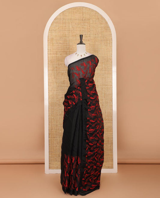 Black all-over feather motifs, red-color thread embroidered Kota chex saree, lace border, and plain black blouse