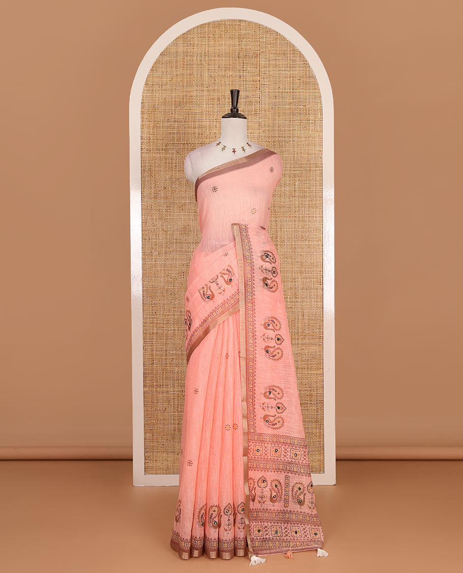 Orange buttas with mirror work linen saree, zari border with peacock motifs print, printed mirror work pallu, and matching blouse