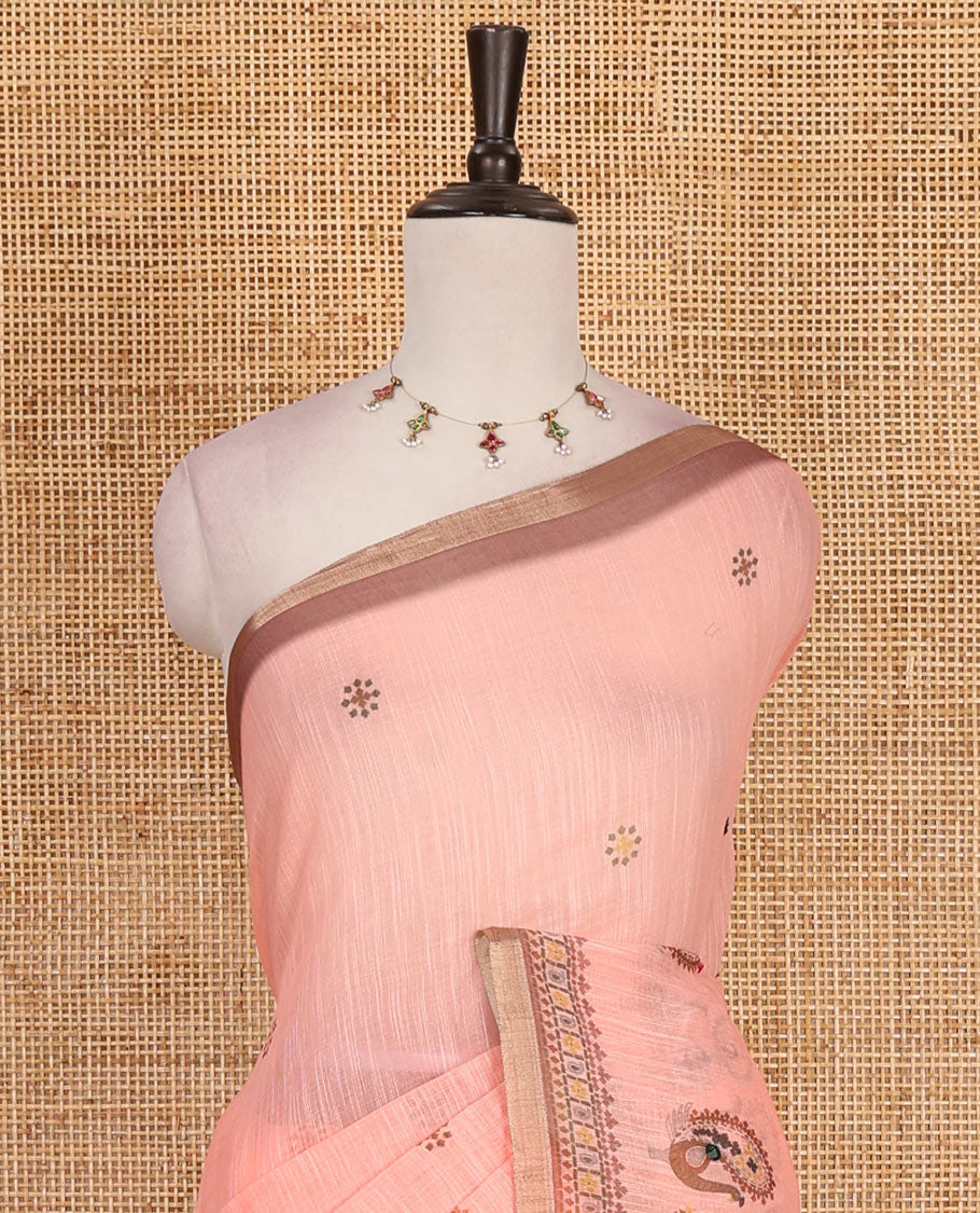 Orange buttas with mirror work linen saree, zari border with peacock motifs print, printed mirror work pallu, and matching blouse