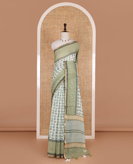 Green cute elephant motifs printed linen cotton saree, contrast chevron border, pallu of stripes and chevron, and contrast printed blouse