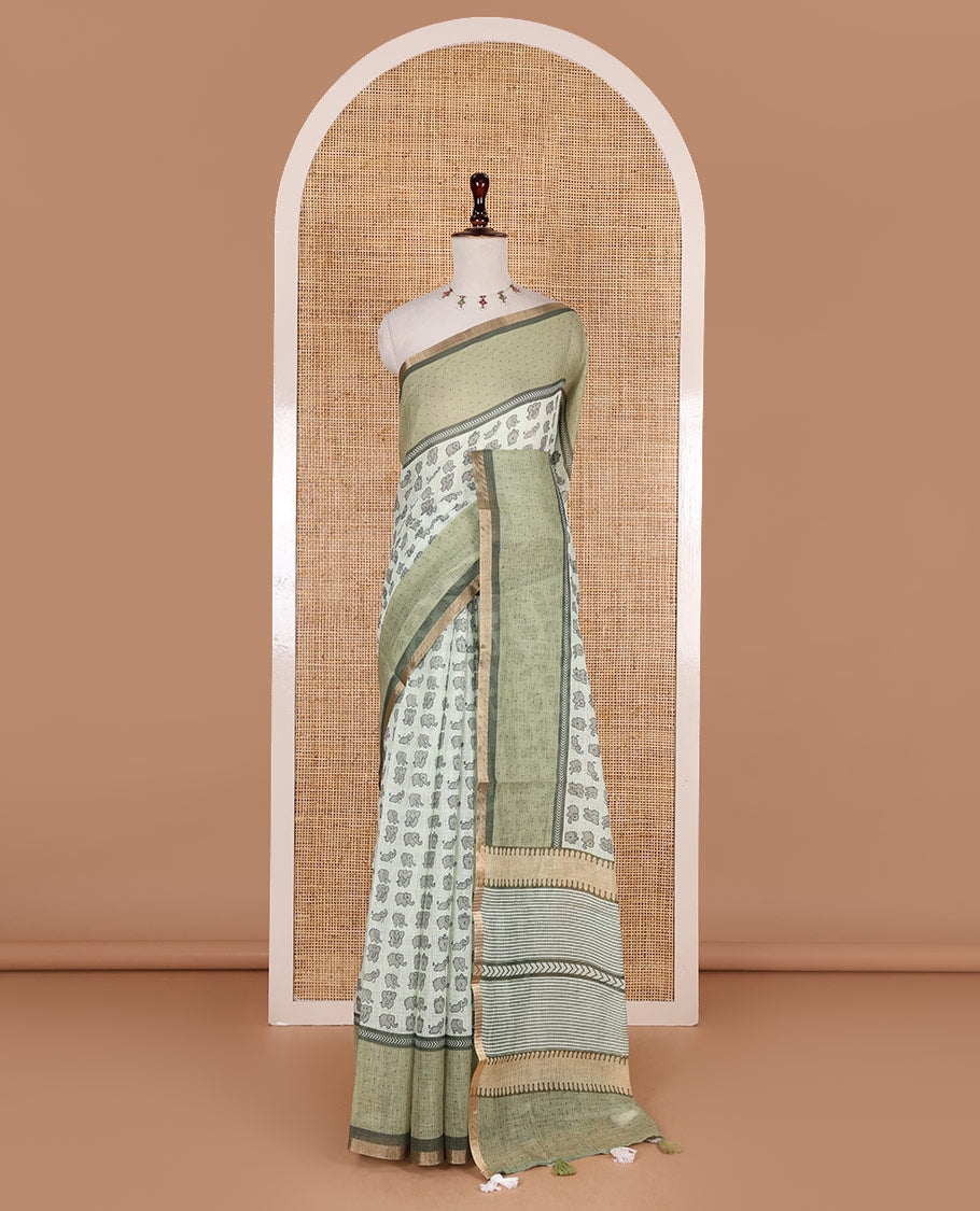 Green cute elephant motifs printed linen cotton saree, contrast chevron border, pallu of stripes and chevron, and contrast printed blouse