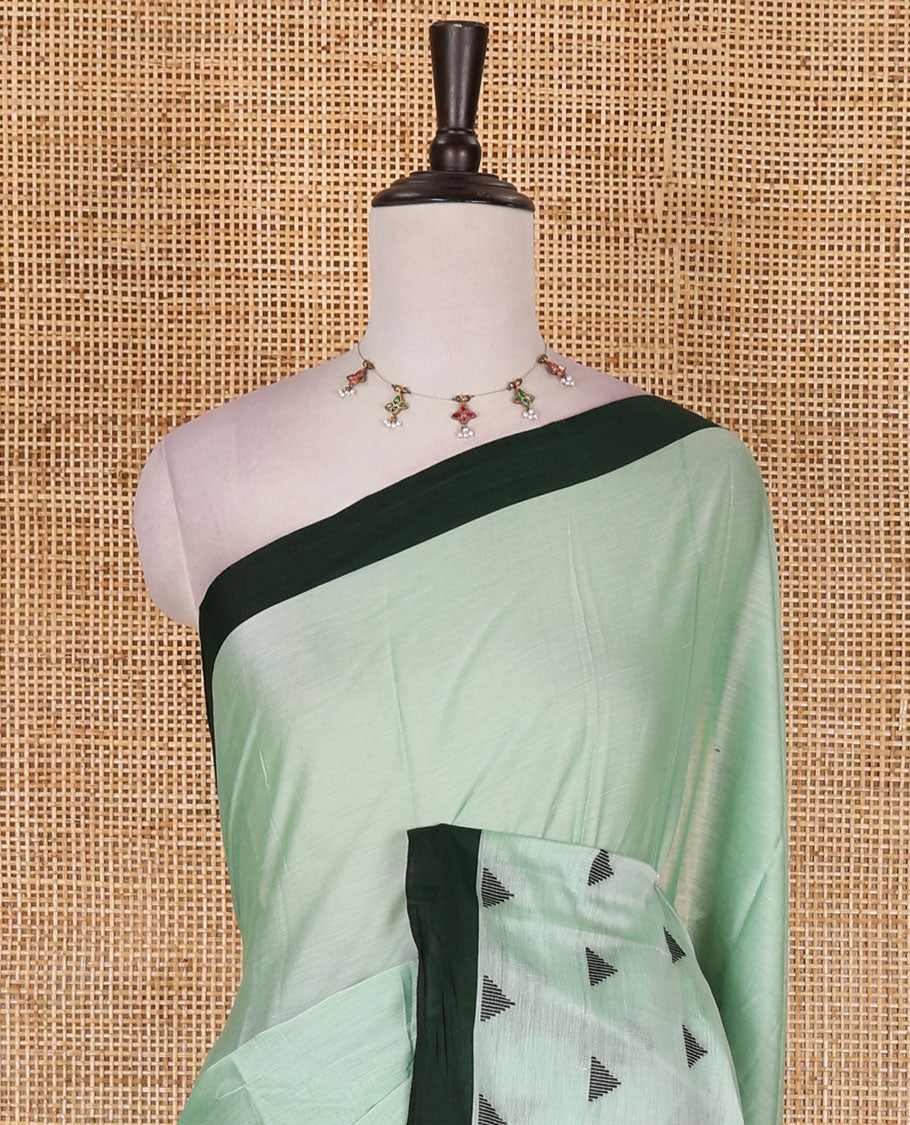 Green triangle motifs mercerised cotton saree, contrast plain border, striped pallu, and matching triangle motifs blouse