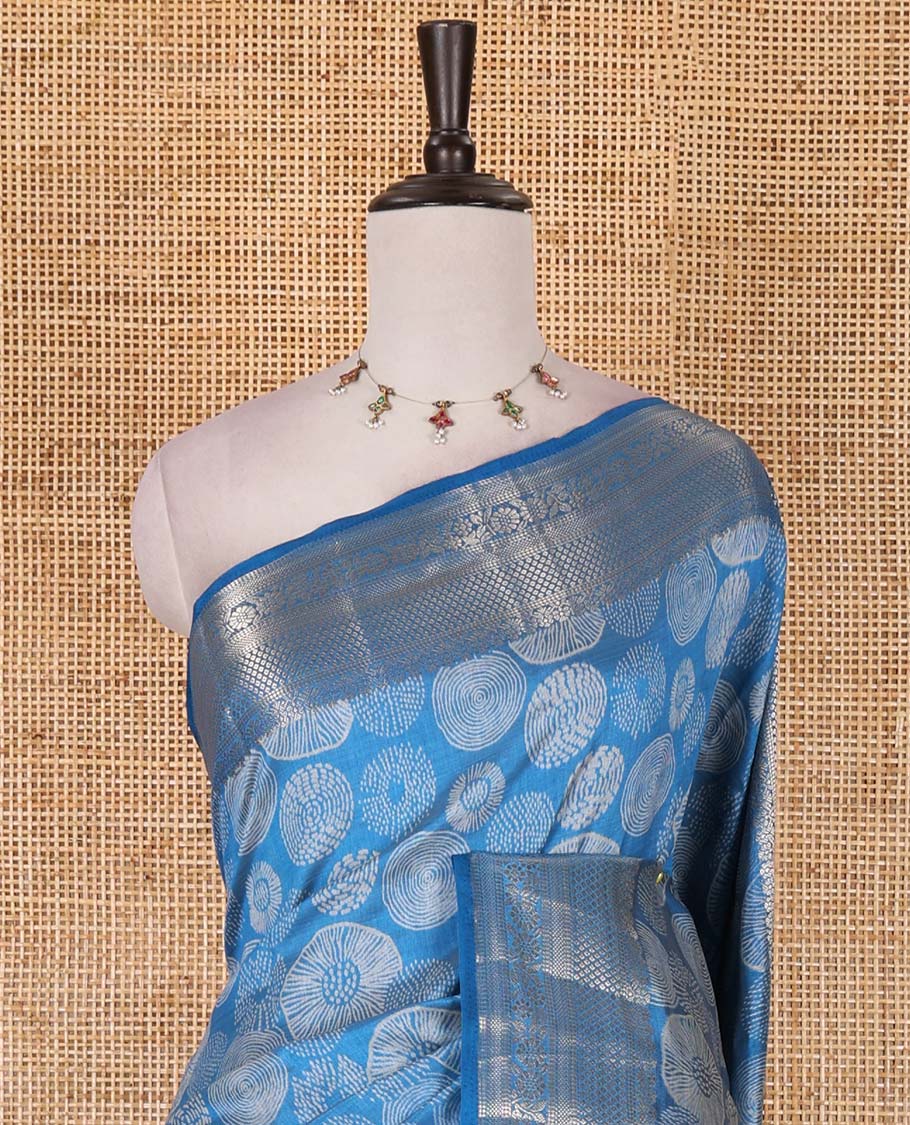 Blue uniquely printed semi-tussar saree, traditional zari border, zari striped pallu, and a matching blouse
