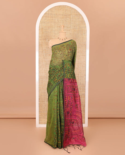 Borderless olive green and pink Warli village printed khadi mul cotton saree, contrast Warli motifs printed pallu, and a plain blouse