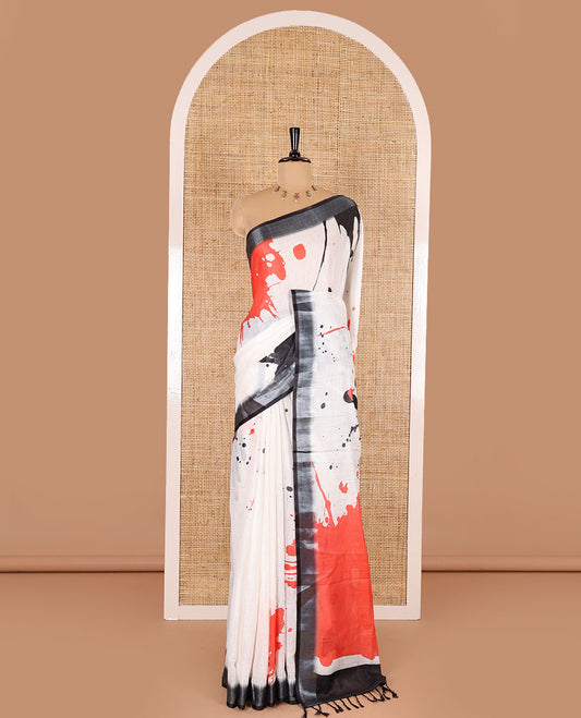 White colorful paint splashes printed linen cotton saree, contrast bavanji border, paint splashes printed pallu, and a contrast ajrakh printed blouse