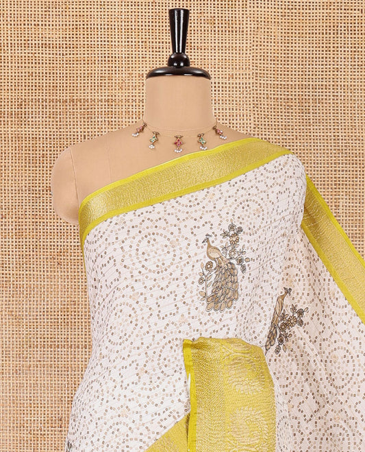 Cream and parrot green bandhani dots and peacock motifs printed dola crush saree, contrast zari peacock border, pallu of abstract peacock print, and a zari design blouse