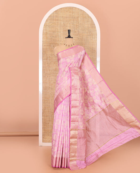Baby pink lotus-leaf style printed semi-tussar saree, traditional zari border, zari striped pallu, and a matching blouse