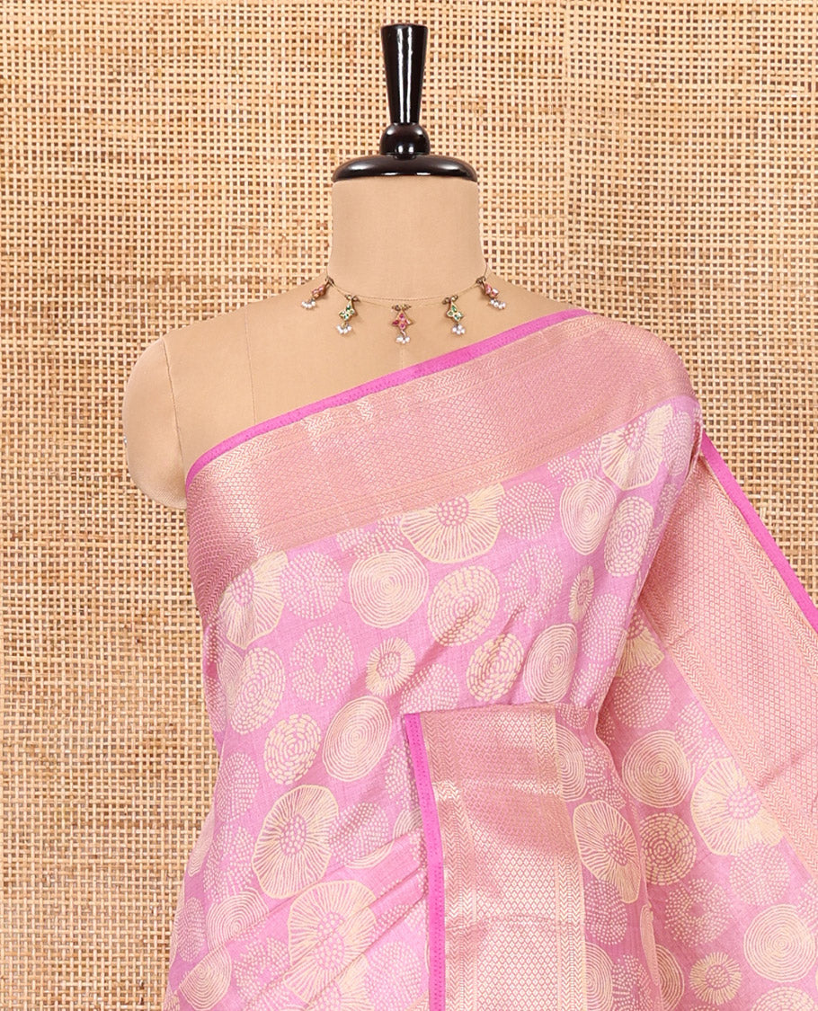 Baby pink lotus-leaf style printed semi-tussar saree, traditional zari border, zari striped pallu, and a matching blouse