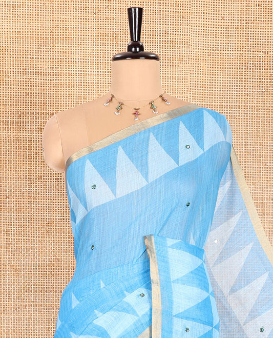 Blue Linen Saree Prettified with Triangle Patterns Print, and Mirror Work All Over Its Body, Subtle Zari Piping Border, Contrast Pallu Mirrors the Same Print, and Paired with a Printed Blouse