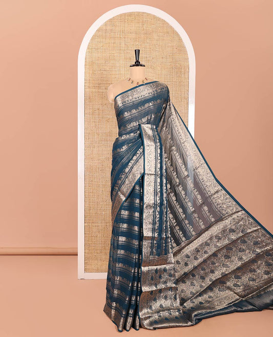 Blue Georgette Saree, Adorned with Zari Peacock Designs All Over Its Body, Highlighted by a Traditional Zari Border, Gracefully Zari-Decked Pallu, and Paired with a Matching Brocade Blouse