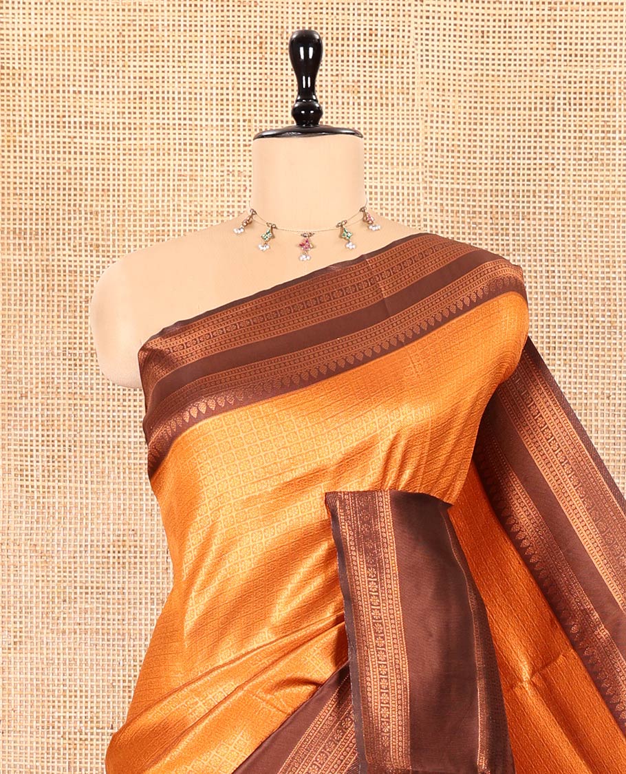Rust Orange Kanchi Silk Saree Elevated with Floral Butta Enclosed Checks All Over Its Body, Complemented by Contrast Traditional Zari Rettai Pettu Border, Majestically Detailed Pallu, and Paired with a Contrast Blouse
